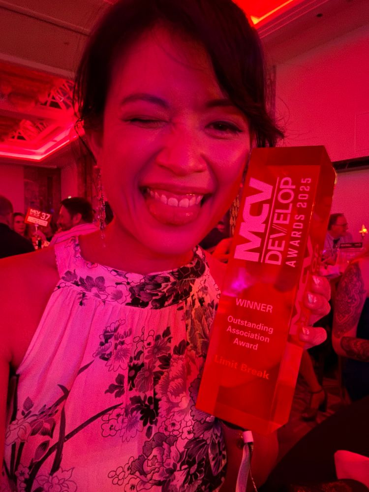 Anisa holding an award for “Outstanding Association Award” for Limit Break at the MCV/Develop Awards 2025