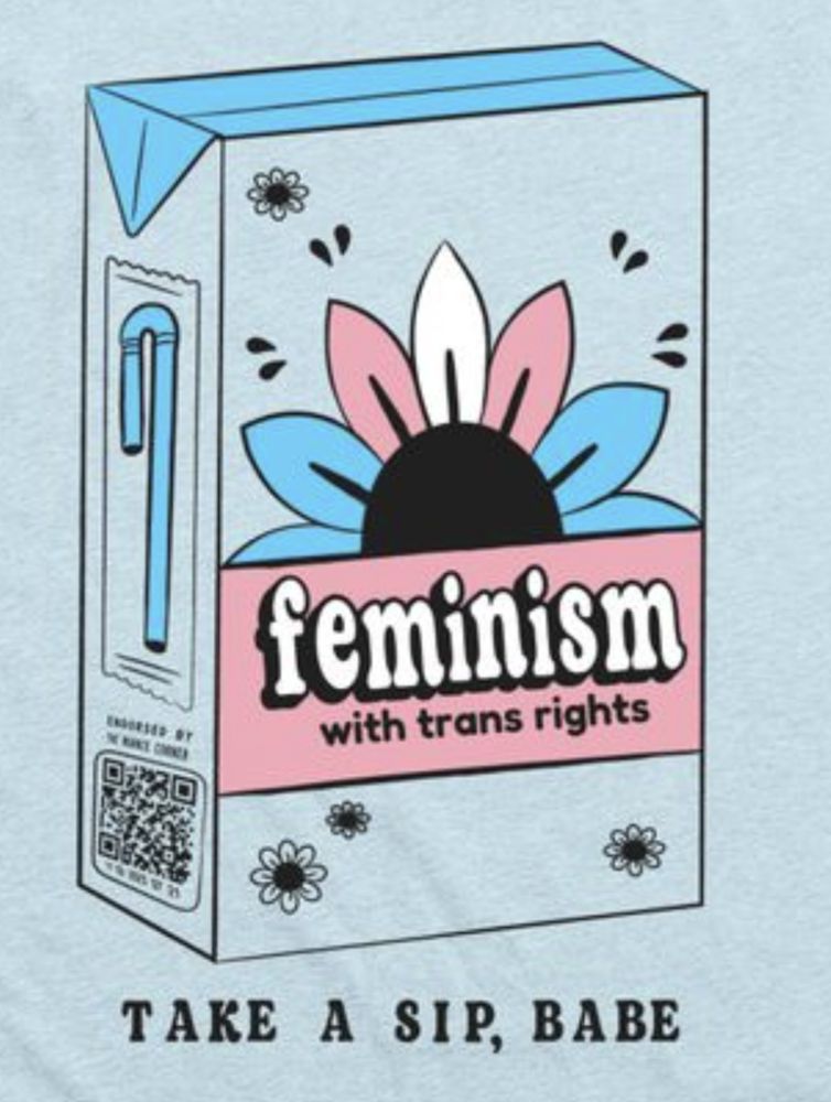 A t-shirt of a juice box with a flower colored in in trans pride colors, the ribbon says feminism with trans rights