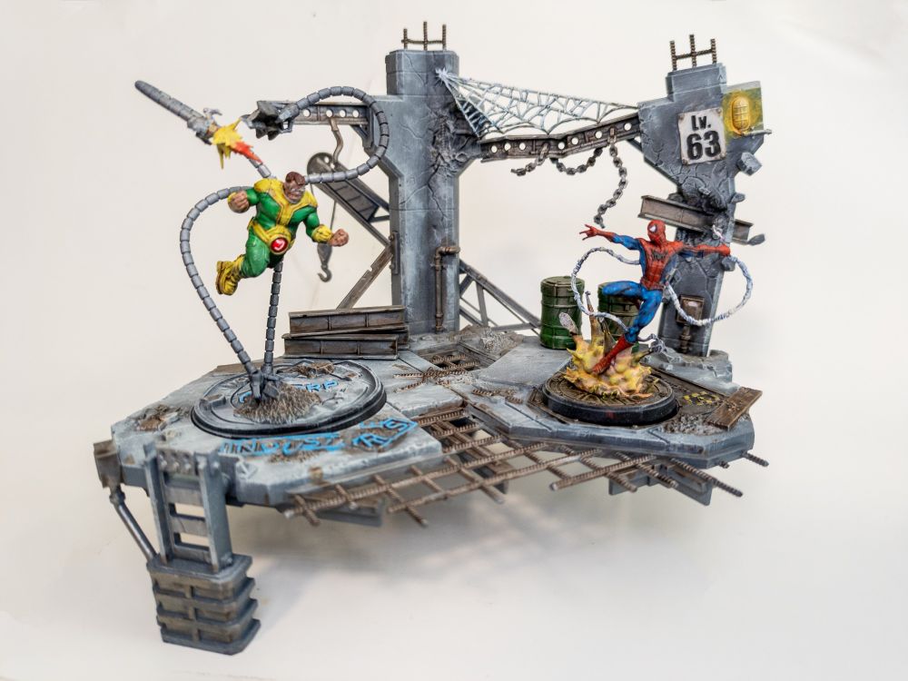 Marvel Crisis Protocol miniatures set of Spider-man and Doctor octopus fighting in a construction yard that is painted brightly.