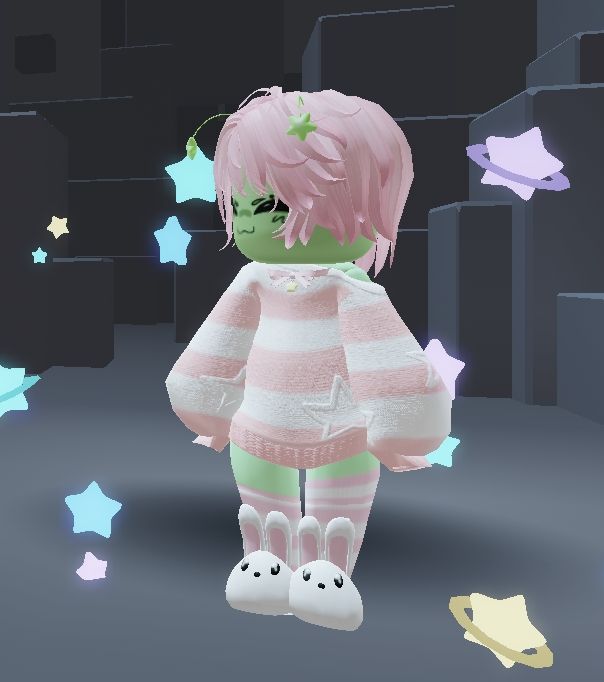 Roblox avitar based on the previous image. Green alien with pink hair, pink and white striped sweater and socks, and bunny slippers