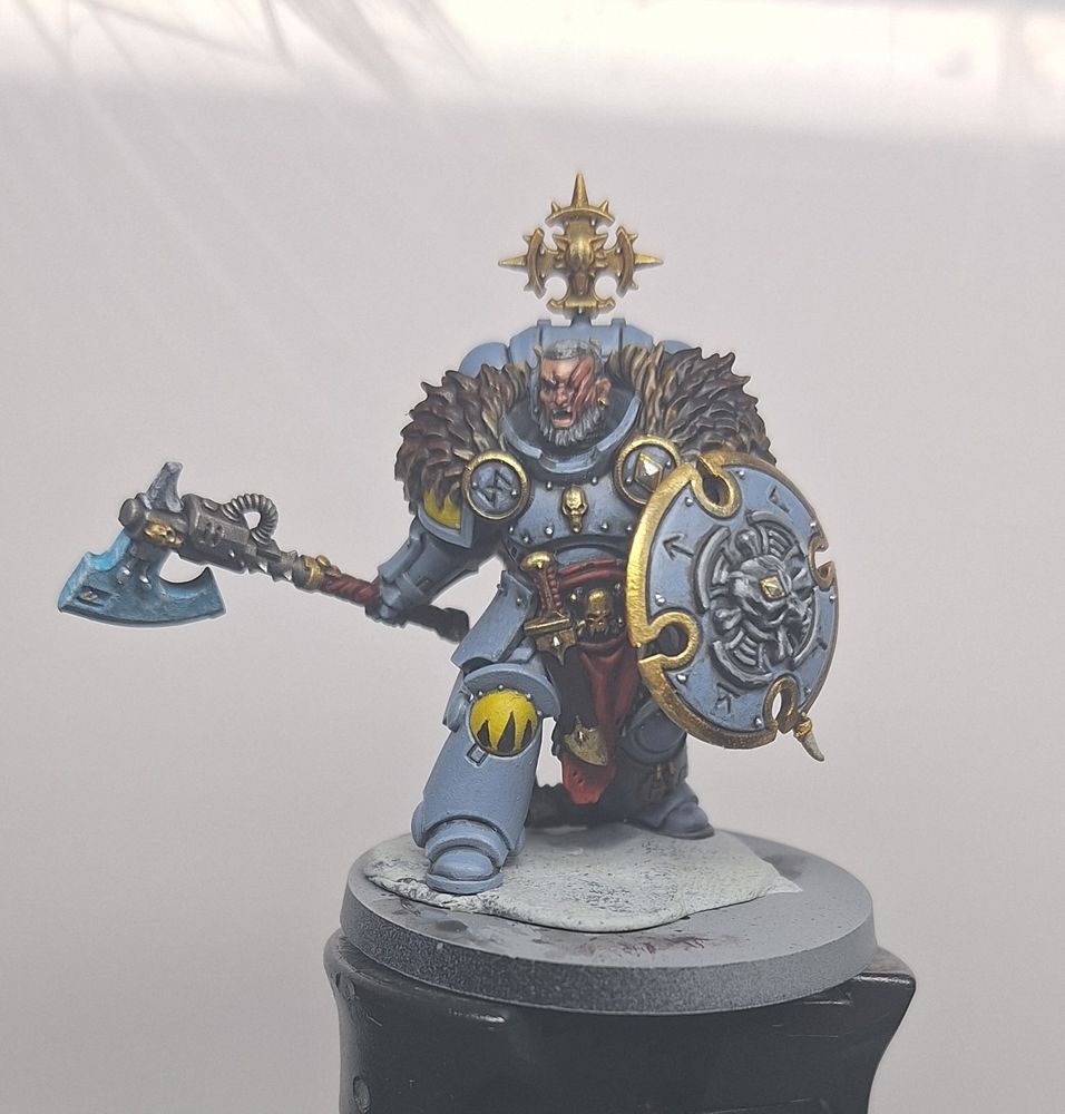 A space wolves Head Hunter with an axe and shield (Front profile pic) 