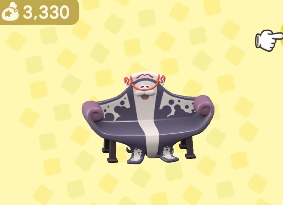 Animal Crossing New Horizons screenshot of a worryingly Big Man (from Splatoon) shaped couch 