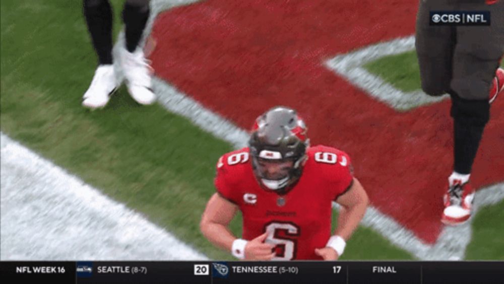 a football player with the number 6 on his jersey is on the field