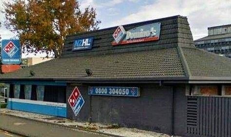 A former Pizza Hut building that now houses a Domino's and a NZHL

guessing on that latter one, I have no idea what NZHL is