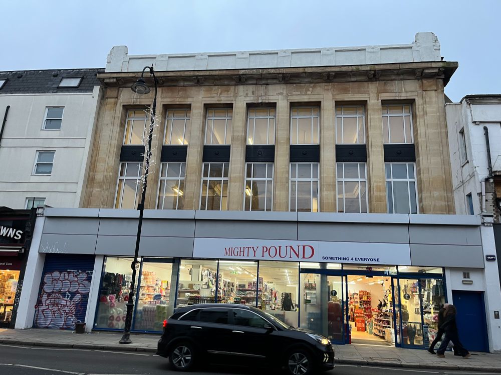 Image shows lights on in the vacant space above former Lidl shop on Kentish Town Road.