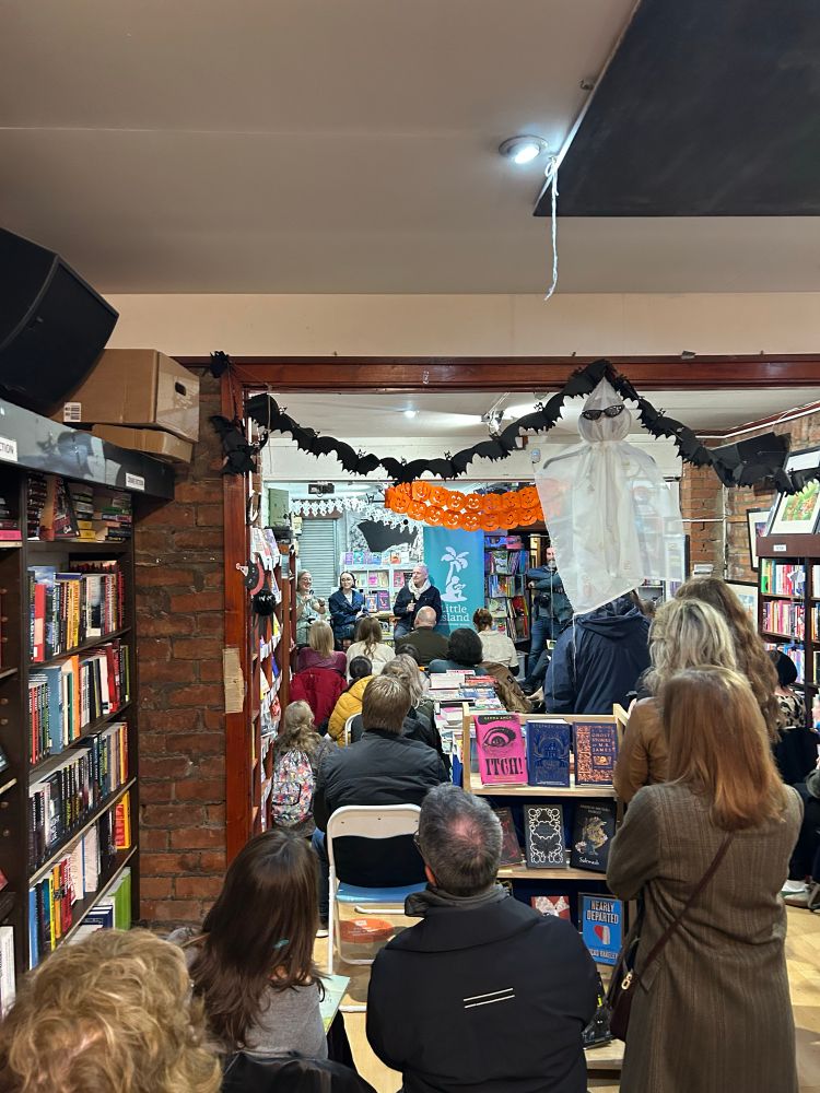 Photo of crowd at book launch in bookshop