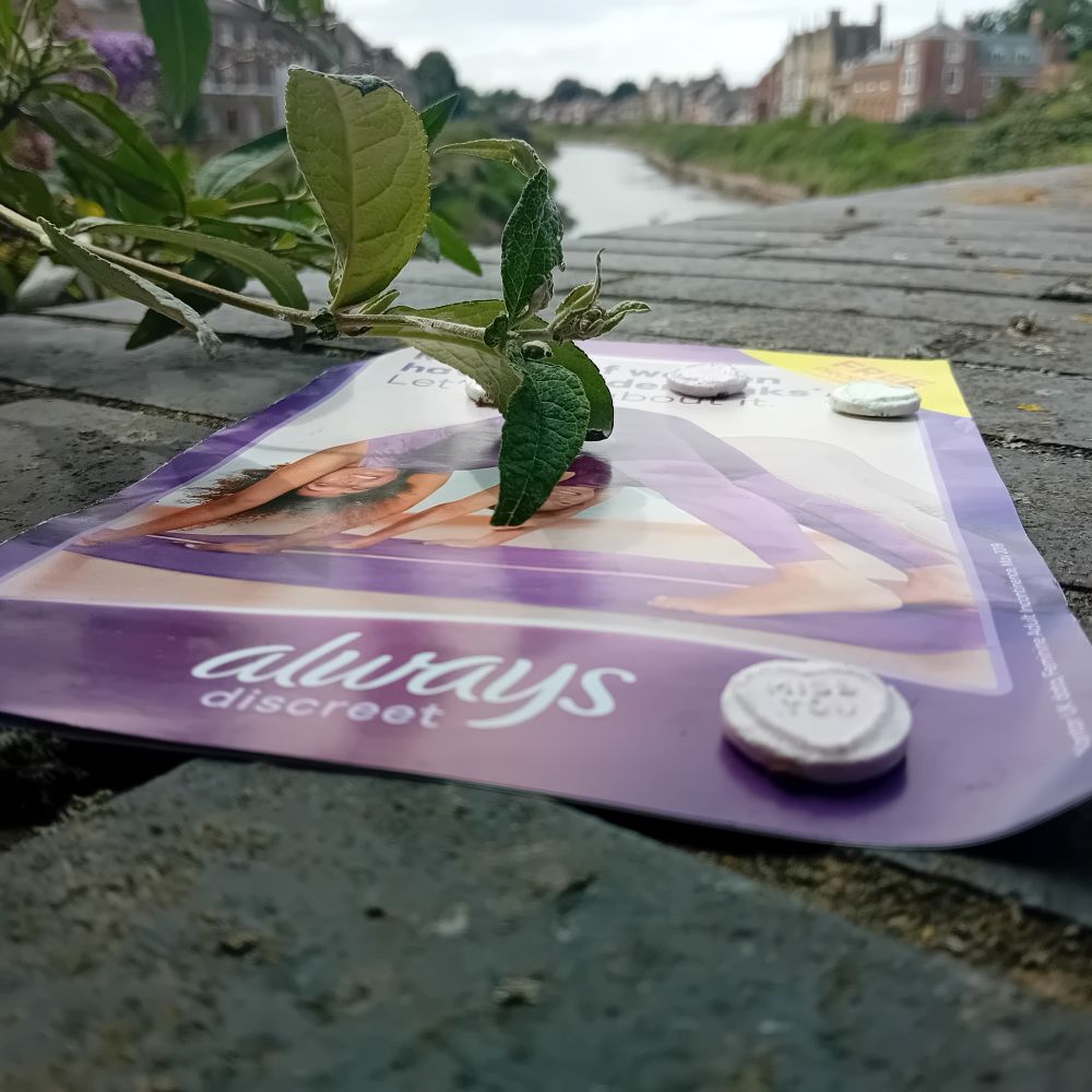 Discarded litter

Loveheart sweets. And an Always Discrete pamphlet that was next to women' sanitary items.