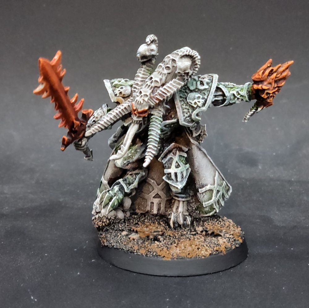Skulltaker painted like a statue with fire weapons