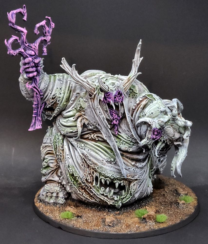 Greater Daemon of Nurgle named Rotigus painted similar to a weathered stone statue with purple/pink glowing energy