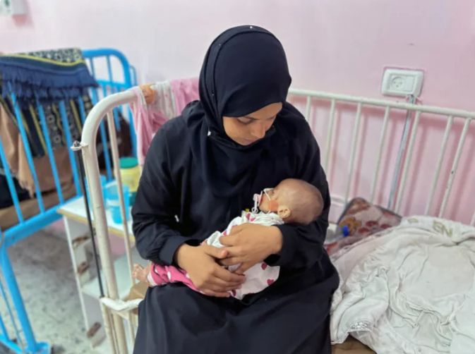Starved baby in Gaza weighed less at death than birth 
The five-month-old girl who died of malnutrition in Gaza today, Zainab Abu Haleeb, weighed just two kilogrammes (4.4 pounds) at the time of her death – smaller than her birth weight of more than three kilos (6.6 pounds), and less than a third the average weight of an infant her age.

Dr. Ahmed al-Farah, head of the paediatric department at Nasser Hospital in Khan Younis, where she was examined, said Zainab had suffered from vomiting and diarrhoea without access to the specialised baby formula she needed. As her immune system collapsed, she developed a bacterial infection and sepsis, causing her to rapidly lose weight, he said, according to The AP news agency.

Zainab’s mother fears that her daughter could be just one of many babies to die due to malnutrition. “Their names are on a list that no one looks at. They are just names and numbers. We are just numbers,” she said.