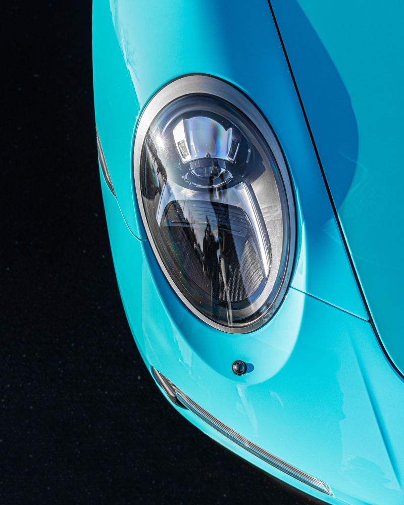 High contrast shot of a porsche headlight 