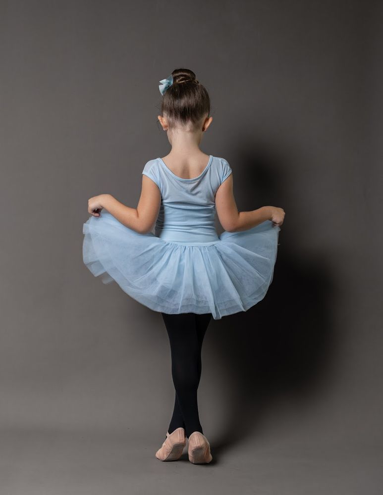 Picture of my daughter. She's in a tutu for ballet, her back is turned to the camera 