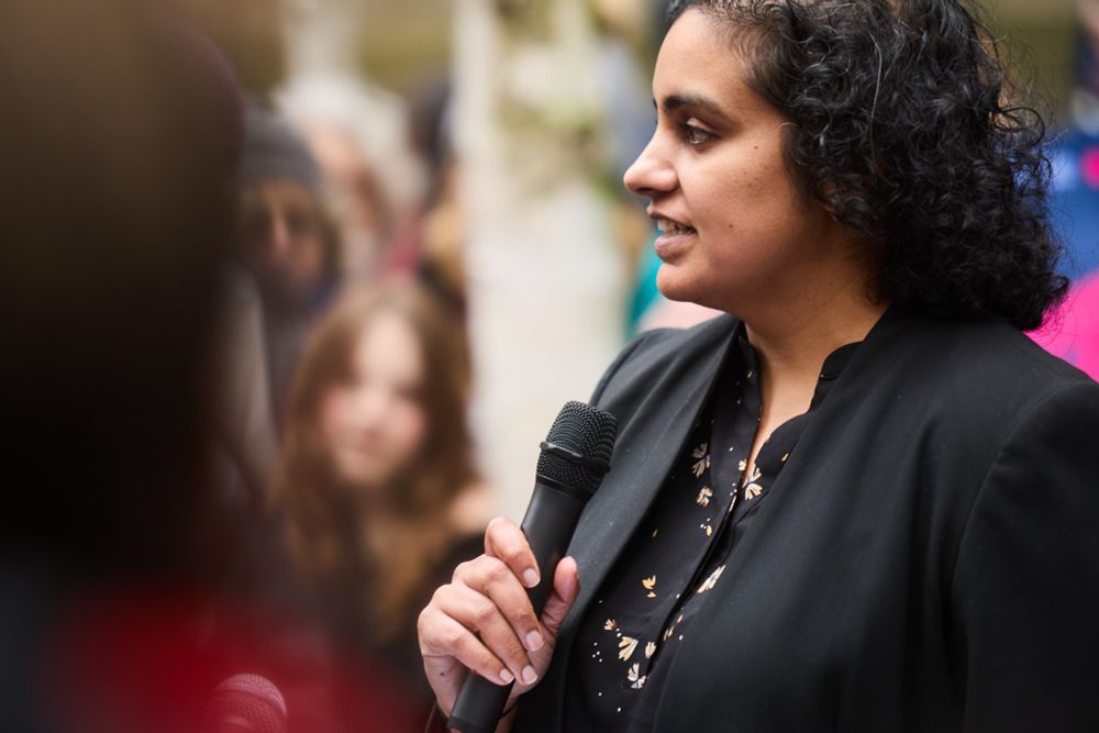 A photo of Deepa Alagesan, Senior Supervising Attorney, Litigation, IRAP speaking at a press conference on the refugee ban lawsuit.