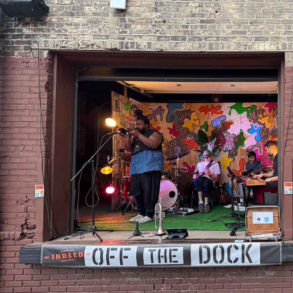 Band playing from a loading dock in NE Minneapolis. Jazz with trumpet, drums, guitar, bass and keyboard. Indeed brewing beer yard and a lovely summer evening. 