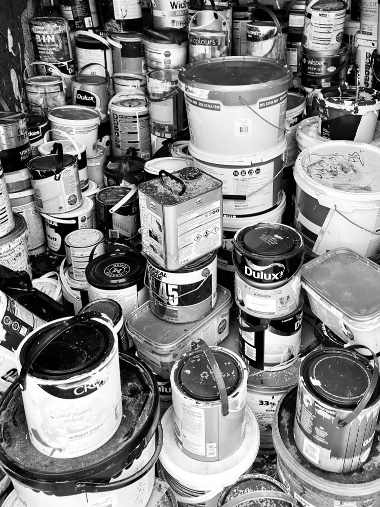 paint tins at the tip