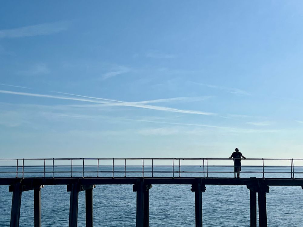 Whitby, UK

man on a pier 
