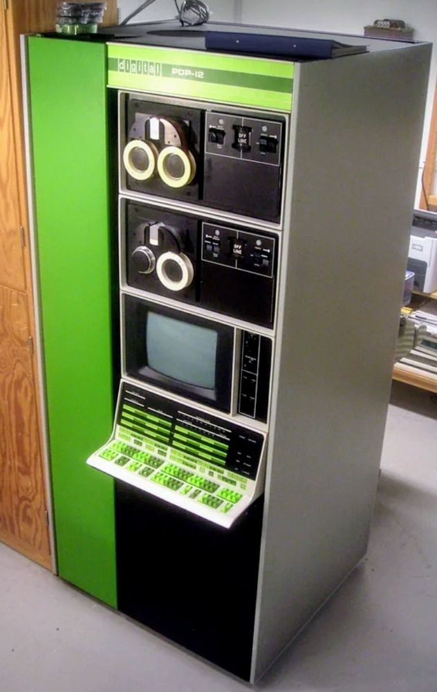 Computer system with monitor, black and white with lime green trim and keyboard buttons 