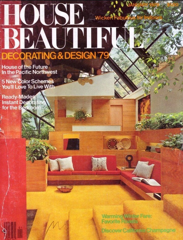 Room with skylights, wood paneling, yellow carpet, red upholstered built-in seating, and multiple houseplants
