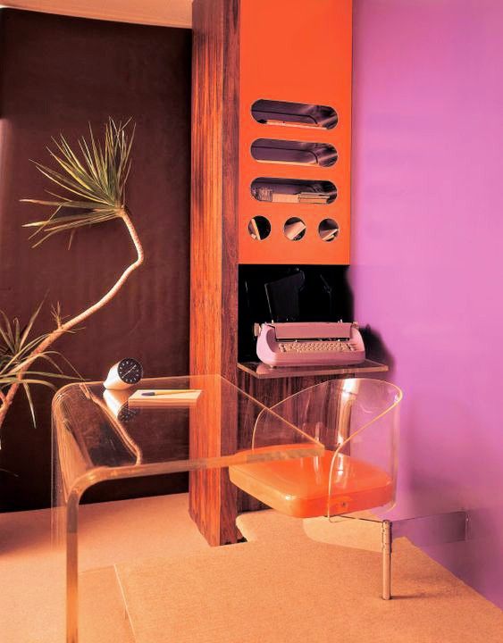 Plexiglas and aluminum office furniture in lavender, orange and wood paneled reception area