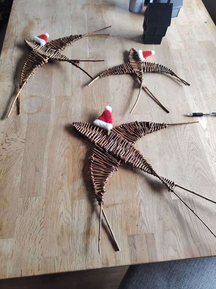 Willow swallows with felted Christmas hats. 