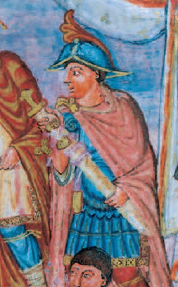 An illustration from the Morgan bible, showing a Carolingian guard holding a scabbarded sword equipped with elaborate fittings.