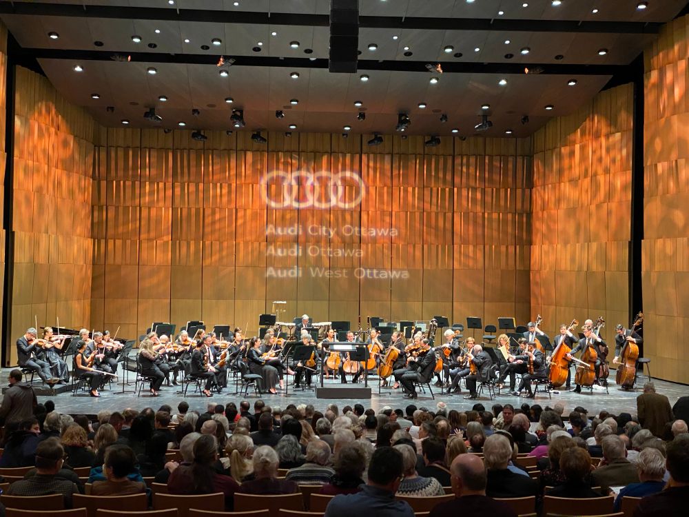 The orchestra fully assembled on the stage of Southam Hall 