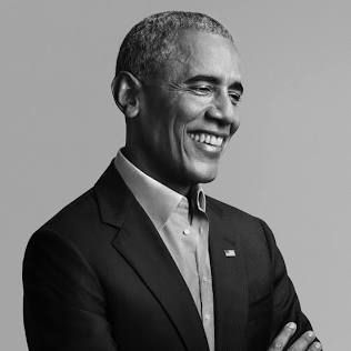 Former American President Barack Obama, smiling.