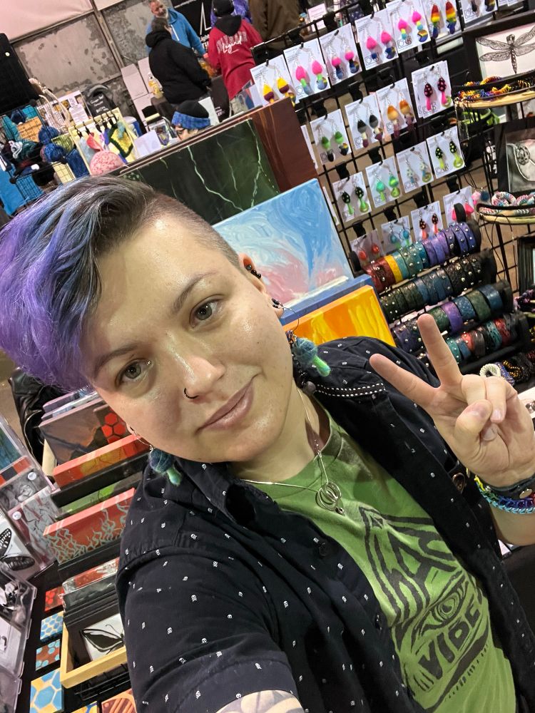 Case in front of their table at YEG Art After Dark