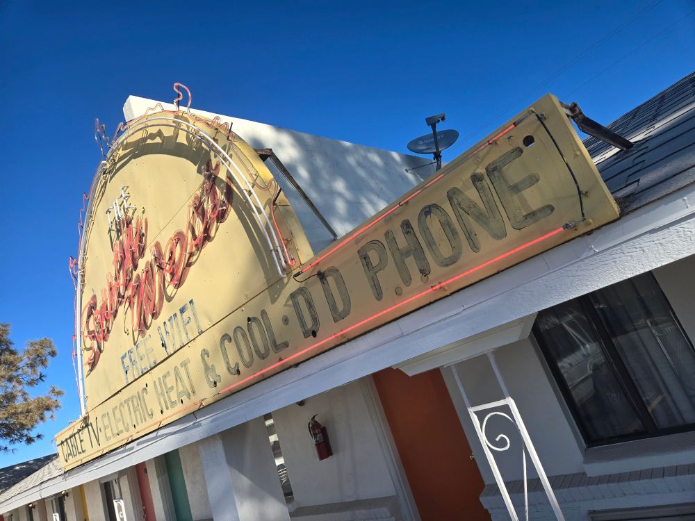 Hotel sign advertising direct dial phone, but it says DD phone