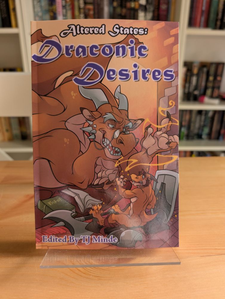 Photo of the Draconic Desires anthology, themed around dragon transformation.