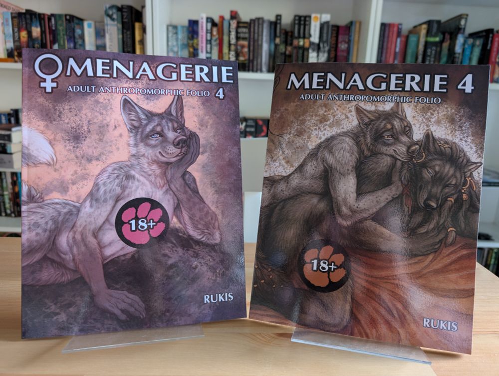 Photo of the Menagerie Male and Female art books by Rukis, which features adult pinups of anthropomorphic characters.