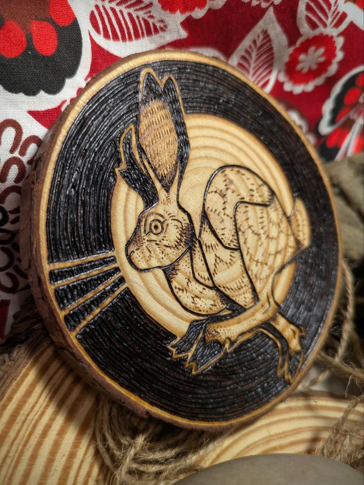 same piece as previous image from a different angle to emphasize the texture of the wood and burn marks.