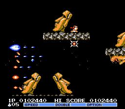 A screenshot of a Gradius game featuring Moai head enemies.