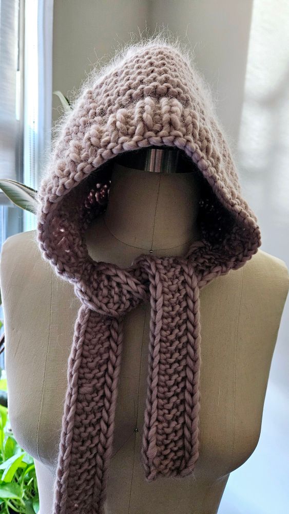 Hand knitted bonnet in lavender 