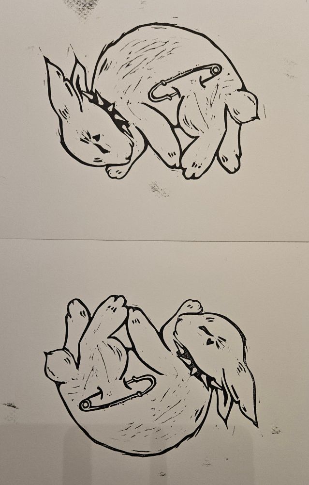 Linocut print of a sleeping bunny wearing a spiked collar and safety pin.