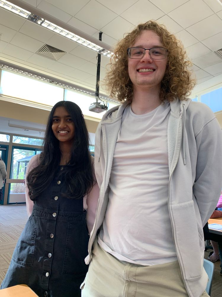 Two high school kids posing for the camera