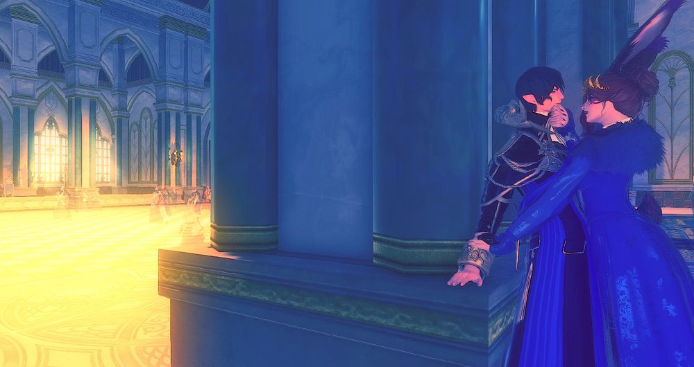 Light shines on a ballroom with several couples dancing on the left side of the image. A pillar serves to hide Aymeric and Agatha in the darkness steps away from the festivities. Agatha holds Aymeric's wrist down with one hand and holds his chin firmly with the other, body pushing his back against the pillar. Aymeric gives her a heated, sensual look in return.
