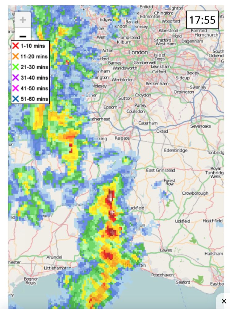 A rain radar map covering London and Sussex showing red colours in a line denoting heavy rain from Brighton to Crawley.