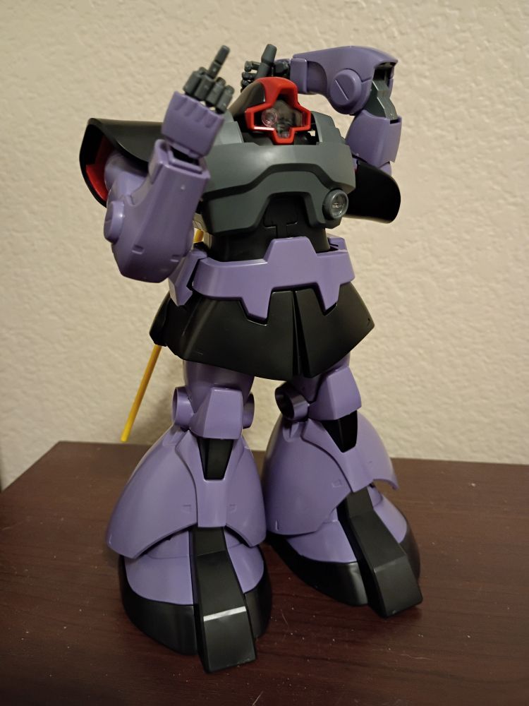 mg rick dom gives the camera the finger while reaching for its heat blade