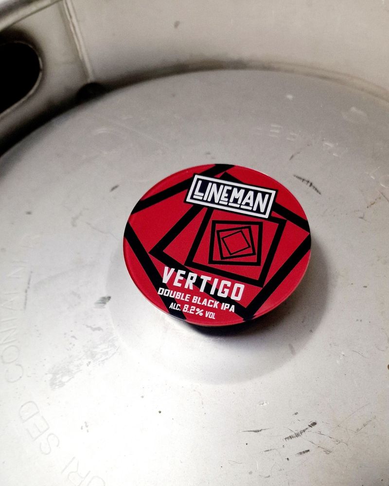 A tap badge on a keg of Vertigo Double Black IPA