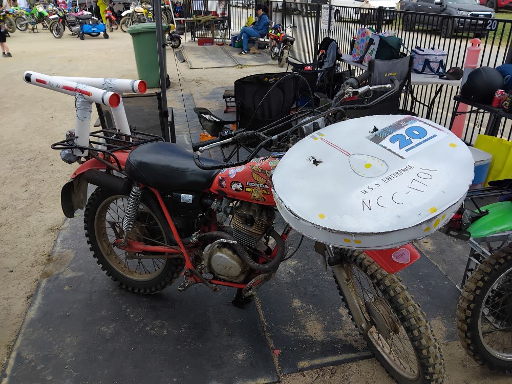 A Honda CT125 with cardboard embellishments to make it resemble the USS Enterprise from Star Trek.