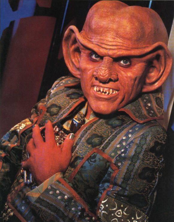 Quark. From Deep Space Nine. Smiling and clutching his breast.