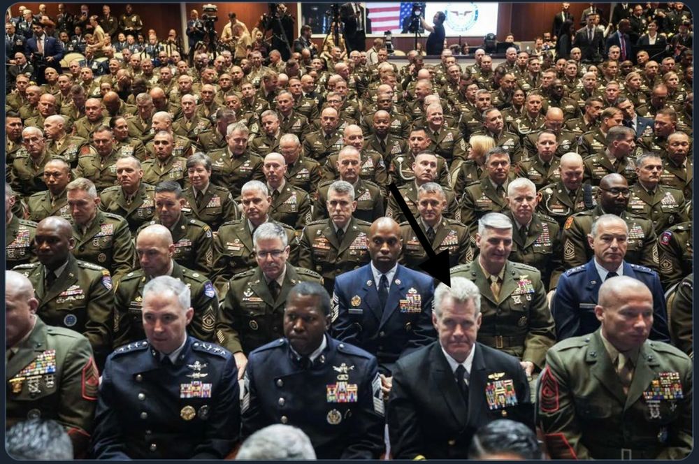 Military Top Brass glaring at the two incompetent idiots on stage