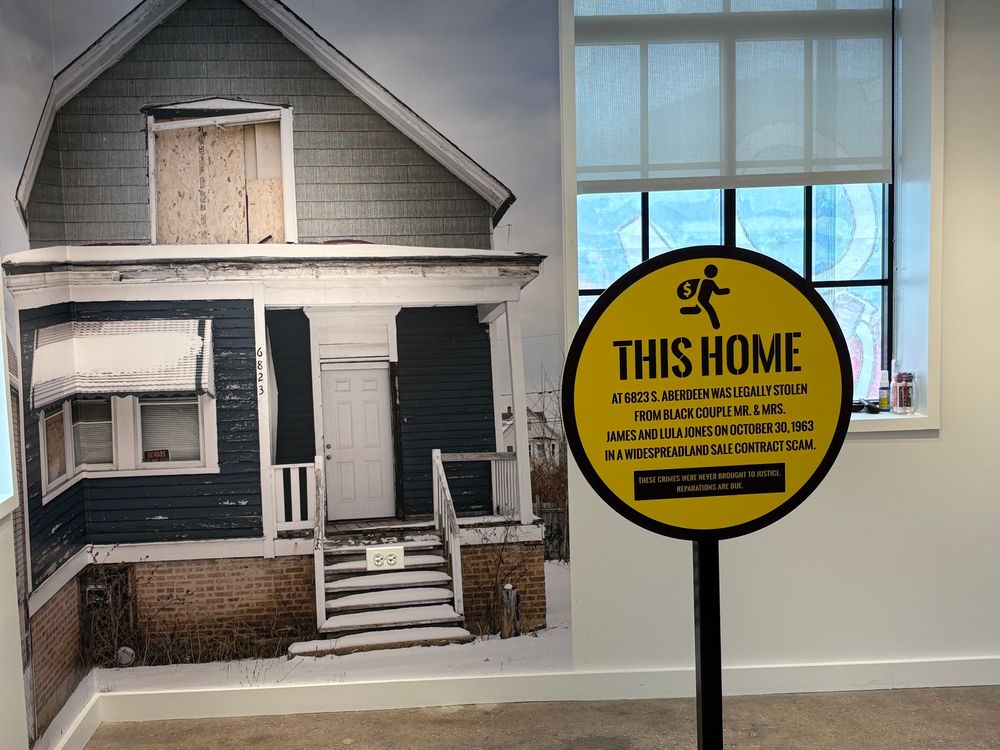 Wall-size image of a boarded up house from Tonika Johnson Inequity for Sale exhibit