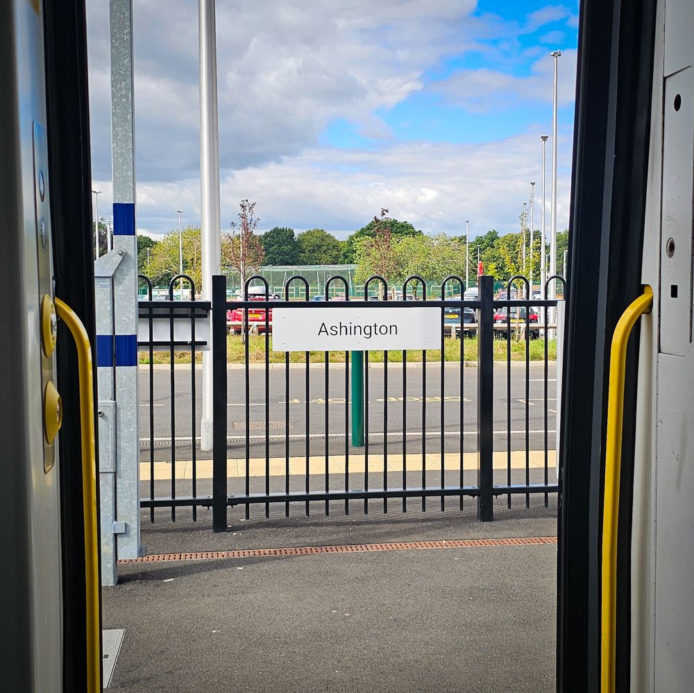 Ashington Station sign from inside a Northern Class 158
