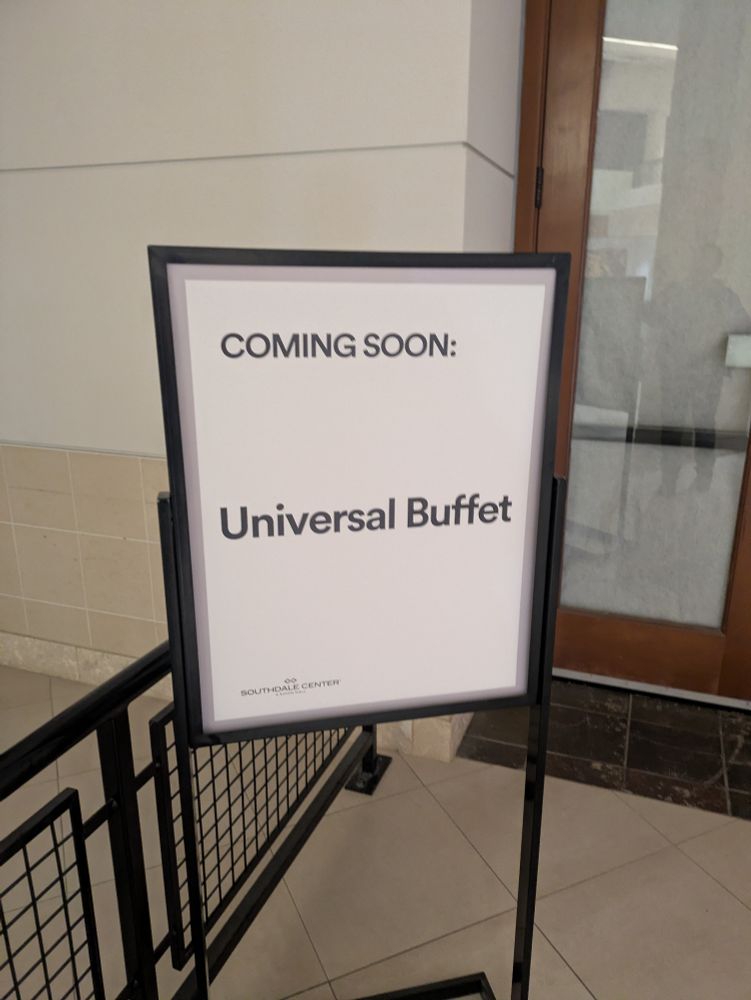 A mall sign saying "Coming soon: Universal Buffet"
