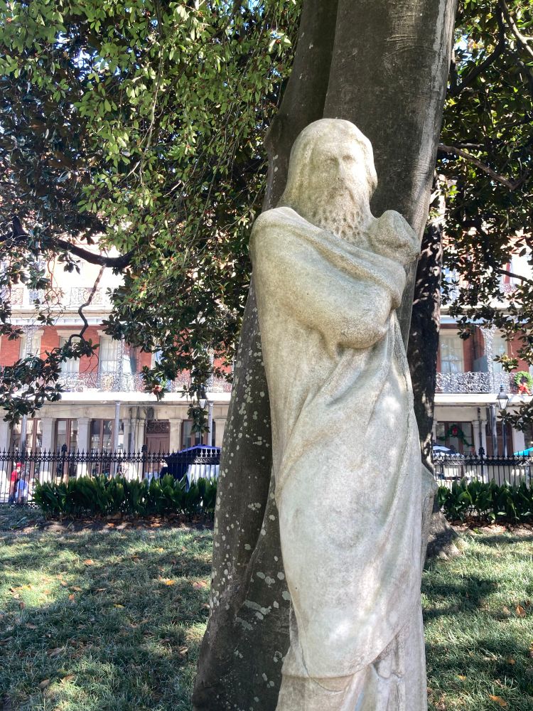 A white stone statue of Jesus in Jackson Square