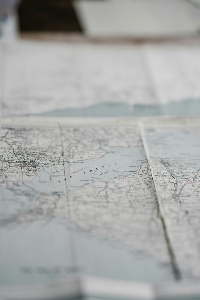 maps paper on table from https://unsplash.com/photos/maps-paper-on-table-Uk3t05ndSng