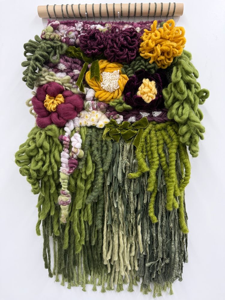 Chunky textural weaving with flower and leaf like shapes. Lots of green, burgundy and yellow yarn.