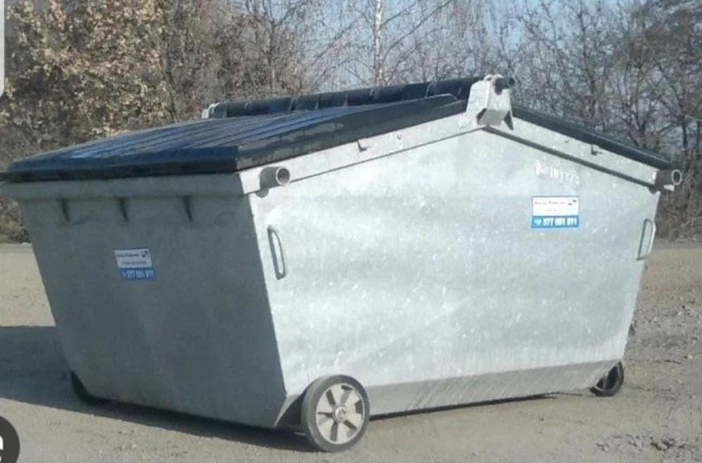 A dumpster with angles making it look similar to a Cyber Truck.